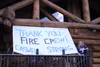 {span}Sheep Creek Lodge co-owner Jessi Zimmerly poses with the sign they made moments after returning home {/span} Tim Rockey/Frontiersman