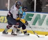 Sam Harrel/News-Miner Fairbanks Ice Dogs defenseman Josh Nelson
pushes Alaska Avalanche forward Andy Pearson off the puck in the
first period of their game Friday, April 9, 2010, at the Big D
