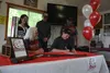 Wyatt Anderson sings his enrollment to Hastings College with his parents Angie (rear left) and Jeff Anderson (rear middle) and coaches, Lindy Moss Head Coach of Alaska YESS ACUI Varsity Team 