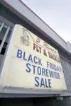 ROBERT DeBERRY/Frontiersman Signs advertising store-wide sales,
like this one at 3 Rivers Fly and Tackle, aim to entice holiday
shoppers.