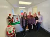 Mat-Su Special Santa Program volunteers Vicky McKenney, Desiree Medina, Dee Chasse, and Joanne Collins pose for a photo at the distribution center in downtown Palmer. Jacob Mann/Frontiersman