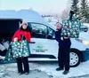 Trish Keown, left, and Dan Kennedy, two local volunteers with Wasilla Area Seniors’ Meals on Wheels program, load Christmas bags for clients recently. Courtesy photo