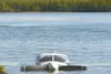 The nose of this 1961 Comanche single-engine airplane sticks out
of Lake Lucille at the Best Western Lake Lucille Inn boat launch
Monday afternoon, The airplan went down in the lake Saturday
