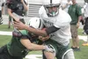 A Colony ball carrier tries to break a tackle during a drill Monday at Colony High School. The Knights open the 2012 season Saturday at Skyview High in Soldotna. JEREMIAH BART/Frontiersman