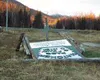 Winds of more than 100 miles per hour were clocked in the
Hatcher Pass area Monday evening. The gusts were enough to bring
down the sturdy log sign that has welcomed visitors to the Hatcher
P