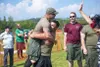 Jake Reynolds power hugs teammate Wesley Powell after the Masters of Iron win the Tug-O-War championship at the 2019 Alaska Scottish Highland Games. Courtesy of Katie Stark
