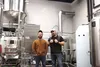Bleeding Heart Brewery owners Stefan Marty and Zack Lanphier stand in front of brewing tanks at their new location under the Water Tower in Palmer. Tim Rockey / Frontiersman
