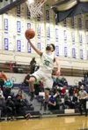 Colony's Jeremiah Hersrud goes to the basket during a state quarterfinal win over West Anchorage. Courtesy of Bruce Eggleston/matsusports.net