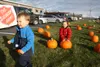 Ethan and Ella Wells pick out their pumpkins during a coat drive for charity. Photos by Jacob Mann/Frontiersman