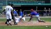 Mat-Su Miners infielder Brett Owen slides underneath the tag of Anchorage catcher Zach Presno during an 8-1 win over the Glacier Pilots Sunday, June 10, 2018, at Hermon Brothers Field in Palm