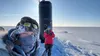 Research professor Andy Mahoney of the University of Alaska Fairbanks Geophysical Institute, left, stands near the USS Hampton’s sail during Operation Ice Camp in March 2024. A civilian emplo