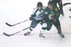 ROBERT DeBERRY/Frontiersman Alaska forward Seth Johnson, left,
battles Kenai River’s Jesse Ramsey during Friday’s season opener at
the Palmer Ice Arena. The Avs dropped a 3-0 decision to the 