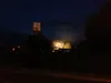 Fire early this morning at the old Matanuska Maid Power Plant illuminates the Palmer water tower. Courtesy Tim Rockey
