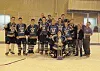 The Big Lake Winterhawks proudly display the championship trophy
shortly after winning the Midget state title. Submitted photo.