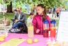 A lemonade stand owner operates her booth during the 2017 Lemonade Day event, created to encourage young kids to explore their entrepreneurial and leadership skills.