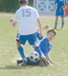 Palmer senior Philip Jansen slides into Soldotna’s Taylor
Jackson to try to create the turnover during the Stars’ 3-0 win
over Palmer on Thursday. Palmer was eliminated from tourney play
with
