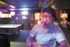 A bar patron at Klondike Mike's Dance Hall and Saloon lights up
a cigar. The Palmer City Council voted not to enact a ban on
smoking in public buildings within the Palmer City limits. (ROBERT
