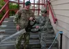 U.S. Army Col. Sean Williams, U.S. Army Alaska chief of staff, and U.S. Air Force Col. Patricia A. Csànk, Joint Base Elmendorf-Richardson and 673d Air Base Wing commander, cut a ribbon during