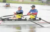 ROBERT DeBERRY/Frontiersman Jacquie Luke and Ken Rice work to
keep a steady pace in the mixed doubles competition during the
Moose Nugget Regatta Saturday at Wasilla Lake.