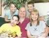 ROBERT DeBERRY/Frontiersman The English family, from left,
Syndi, Thomas Jr., Thomas, Dakoda and Gina pose for family photo in
their Palmer area home.