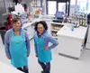 Hearts and Hands of Care Wasilla office manager Nicole Rosevear, left, and cafe manager Kamarae Kaina pose for a photo in the newly remodeled cafe on July 1, 2016. The cafe provides an employ