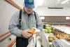 Bruce Bush of Bushes and Bunches Greenhouse cleans off pie pumpkins during a previous Mat-Su Farm Market at the Palmer Train Depot. The market continues from 11 a.m. to 7 p.m., Mondays throug