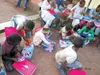 Students at Christ Hope Orphanage in Tanzania, East Africa, open gift boxes from students at Our Lady of the Valley Catholic School in Wasilla. Courtesy photo
