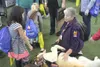 Expo attendees in 2018 visit with emergency service dogs. File art