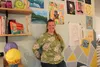 Brush and Glaze Learning Studio owner Rachel Skinner stands in front of various works of art made by her students. Jacob Mann/Frontiersman