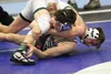 Colony Aidan Ehmann works to keep a grasp on Wasilla's Alex Logsdon during the 119-pound final of the Lancer Smith Memorial Saturday in Wasilla. Jeremiah Bartz/Frontiersman