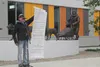 Barb Redington spoke at the official dedication of the Joe Redington Sr. sculpture at his namesake junior/senior high in Knik. She finished stating the lifesized statute is one more item of m