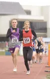 ROBERT DeBERRY/Frontiersman Wasilla’s Jenna Ford leads Skyview’s
Ivy O’Guinn on the first lap of the girls’ 3,200-meter run Friday
at Palmer High School.
