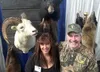 Tasha Buxton, left, and Mark Randolph of Randolph Taxidermy pose for a photo on Friday during the Mat-Su Outdoorsman Show at the Menard Center in Wasilla. MATT TUNSETH/Frontiersman.com