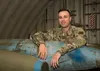 U.S. Air Force Tech. Sgt. Nicholas Kern, the 3rd Munitions Squadron training section chief, pauses for a photo in the combat munitions training facility at Joint Base Elmendorf-Richardson, Al