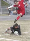 Wasilla senior forward Kyle Welton leaps over the Grace
Christian goalie in Saturday’s NLC title match. WHS advances to
state as the conference champs. (JEREMIAH BARTZ/Frontiersman)