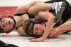 Wasilla's Kayden Wall tries to turn Colony's Trace Severson during a 106-pound semifinal match of the Northern Lights Conference Championships Dec. 11 at Wasilla High School. Wall won the mat