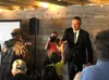Gov. Mike Dunleavy high-fives 10-year-old Corey Donelly after speaking at the ‘Save the PFD Rally Thursday night at Everett’s. Tim Rockey/Frontiersman
