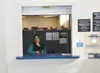 U.S. Postal Service retail specialist Jennifer Rasmussen poses at the new customer service window at the Wasilla carrier annex. Chelsa J. Photography
