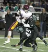 Colony's Jordan Nero (2) and Nolan Martin (45) work to tackle Dimond's Rafa Zavala during a playoff loss to Dimond Oct. 9 at Colony High School. Nero was recently named the Alaska Large-Schoo