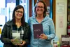 From left, writers Alyse Knorr and Kate Partridge stand with their books at Fireside Books on Sunday. KATIE STARK/Frontiersman