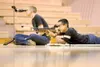 Colony sophomore Keiran McCafferty shoots at his targets as team
captain Lyle Swallows watches through the spotting scope. (ROBERT
DeBERRY/Frontiersman)