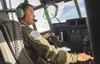 A pilot with the 211th Rescue Squadron, based at Joint Base Elmendorf-Richardson, performs low-level proficiency training in a HC-130J Combat King II above the diverse Alaska landscape Sept. 