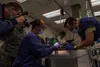 U.S. Air Force and U.S. Army members perform and assist during a root canal on a military working dog (MWD) at Fort Wainwright, Alaska, Sept. 5, 2019. Broken teeth can be a source of infectio