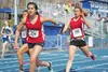 Wasilla’s Ceil Dunleavy takes the baton from teammate Andrea Wagner at the start of the third leg of Friday’s 4x200 relay at the annual Palmer Invitational and Relays. MARK KELSEY/Frontiersma