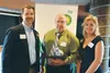 Colony High School teacher and athletic coach Fred McKenney, center, stands with school district superintendent Deena Paramo, right, and Stan Bennion, Vice President of Human Resources for BP