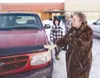 Susan Lawler looks over a Ford Explorer that was donated to the
Lawler family through the first Wheels of Hope program at the
Alaska Family Services in Palmer. The program is a collaboration
