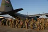 Airborne members of the 4th Brigade Combat Team (Airborne), 25th Infantry Division stationed at Joint Base Elmendorf-Richardson, Alaska board a C-130J flown by the 327th Airlift Squadron duri
