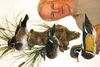 Charles Lochner displays one of his duck carvings. Lochner said carving ducks prepared him for “the culmination of [his] talents,” a life-size sculpture of the crucifix. Above, a carving of a