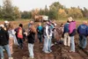 COURTESY PHOTO/Alaska AITC Elementary teacher Jodi Talcott, far
right facing center, and Glacier View School students look for
potatoes on the ground as the VanderWeele Farms harvester digs
p
