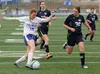 Palmer senior Dori Schneider works her way past a pair of defenders during a 6-0 win over Redington Monday, May 14, 2018, at Palmer High School. JEREMIAH BARTZ/ Frontiersman